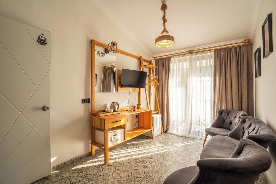 Superior Triple Room | Living area | Smart TV