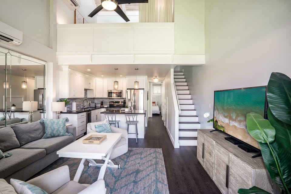 Spacious living room leads to a loft