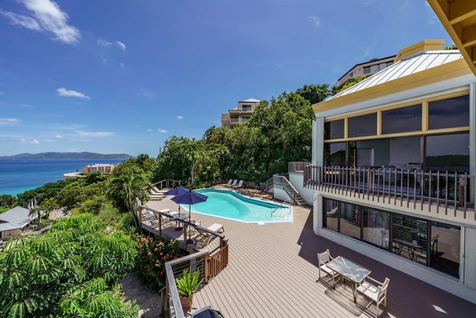 The expansive pool and pool deck with an incredible view, BBQ grill, wifi, sun loungers, and outdoor furniture.