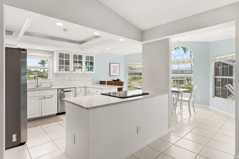 Relish the new quartz countertops with the open concept kitchen.