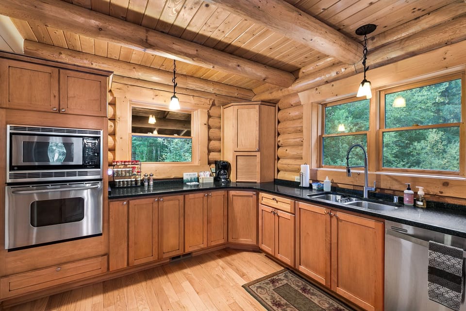 Stainless steel oven, microwave, and dishwasher pictured