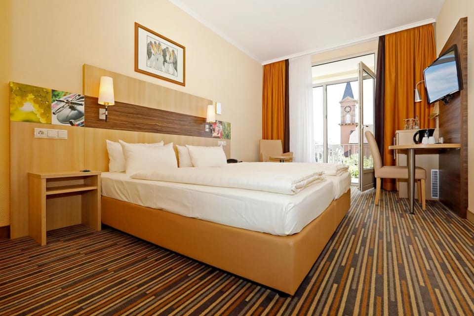 Hypo-allergenic bedding, free minibar, in-room safe, desk