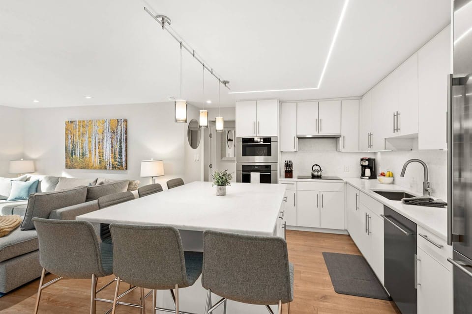 The open floor plan of this contemporary vacation rental provides a relaxing and inviting space to relax on your trip to Aspen.