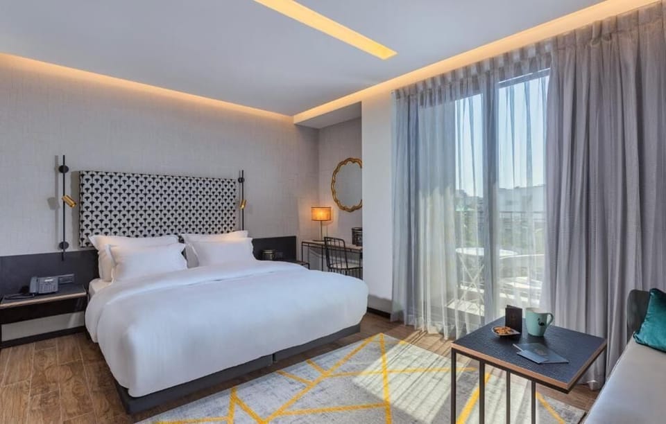 Deluxe Double Room, Balcony | Desk, blackout drapes, bed sheets