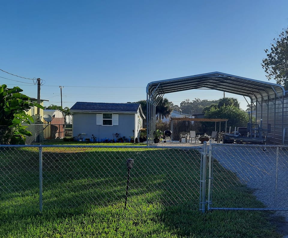 You park under the carport. Fenced in yard.