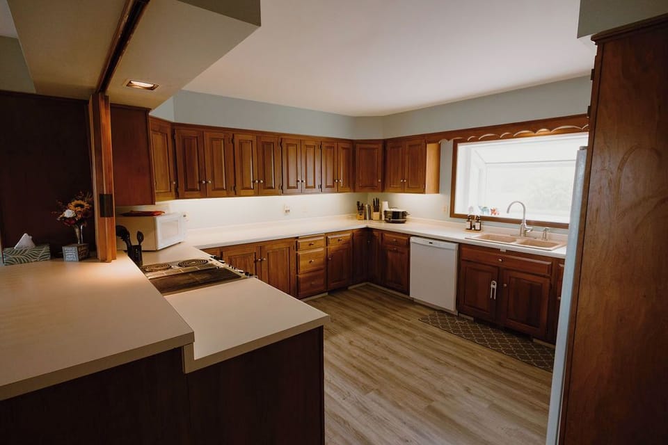 A large kitchen with a dishwasher and a lot of counter space. 