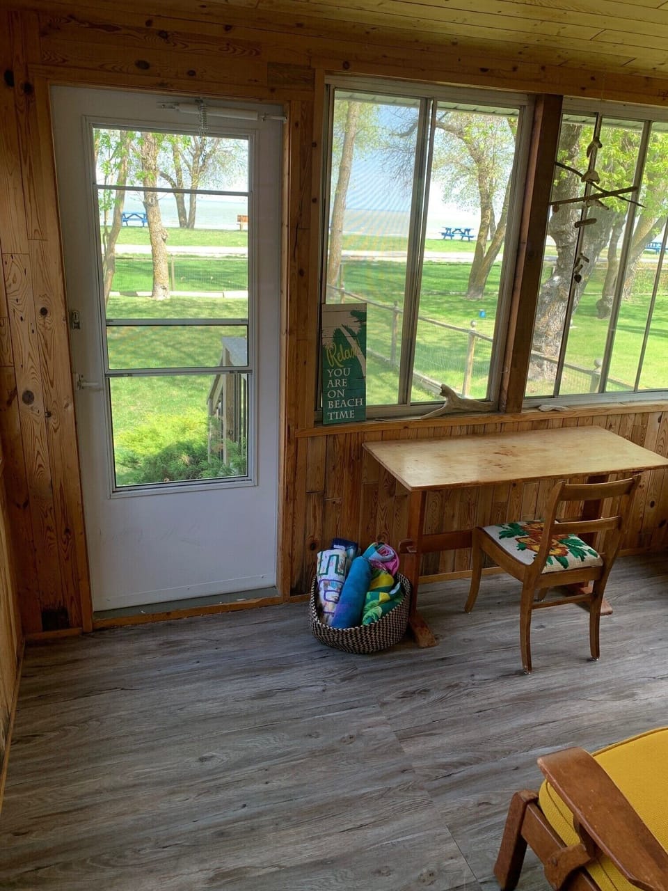 screened room is perfect for socializing and has a fold out bed for summer use