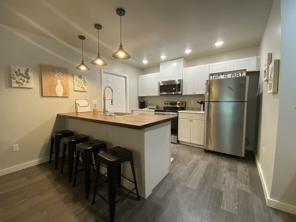 Modern kitchen fully equipped for your dine in needs. Keurig, crockpot, toaster.