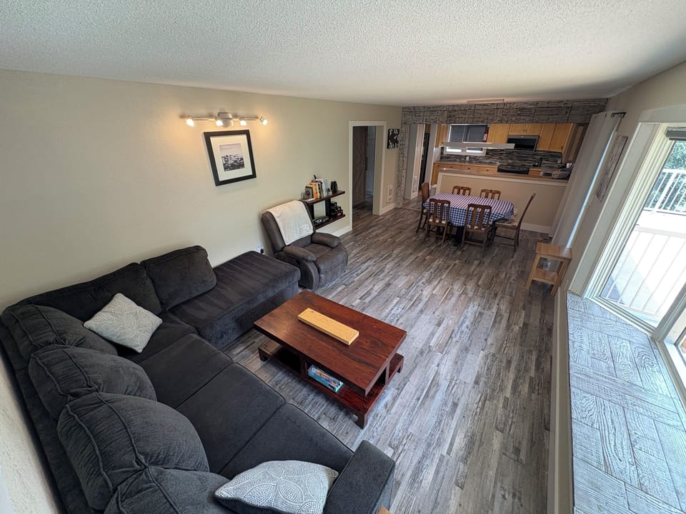 Main-level living room—cozy seating and open flow for family gatherings.