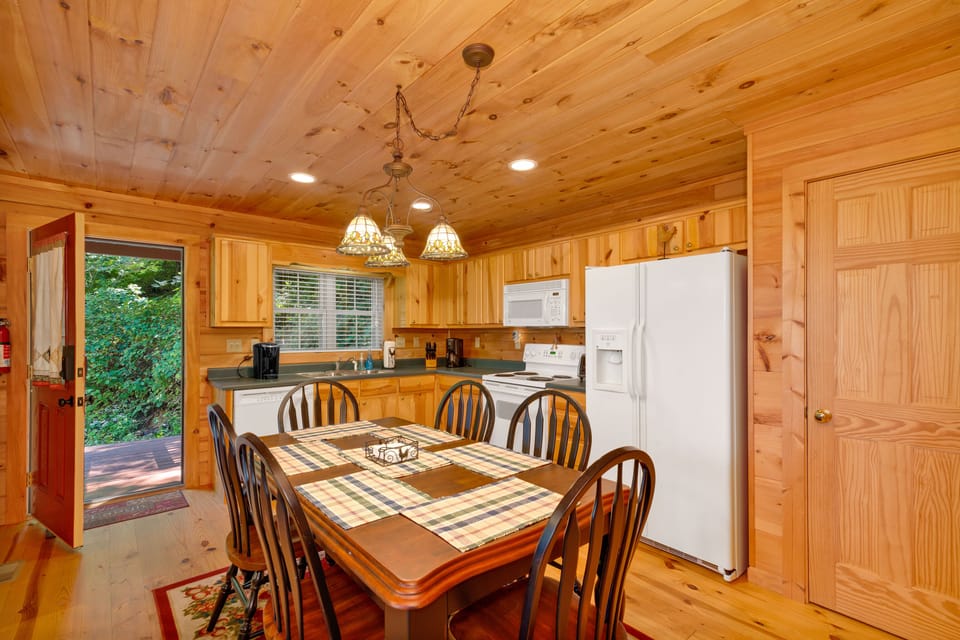 Large eat-in kitchen fully stocked with all the conveniences from home.
