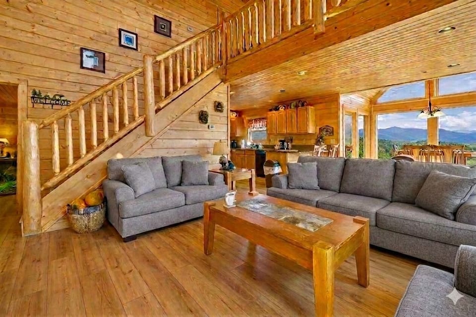 Step into this spacious living room where mornings begin with soft sunlight streaming through the windows and evenings end with laughter by the fire. It’s the heart of the cabin a place to gather, relax, and make memories that linger long after your stay.