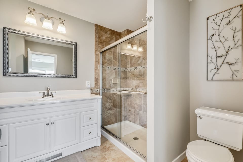 fourth floor primary master bath with shower and bathtub