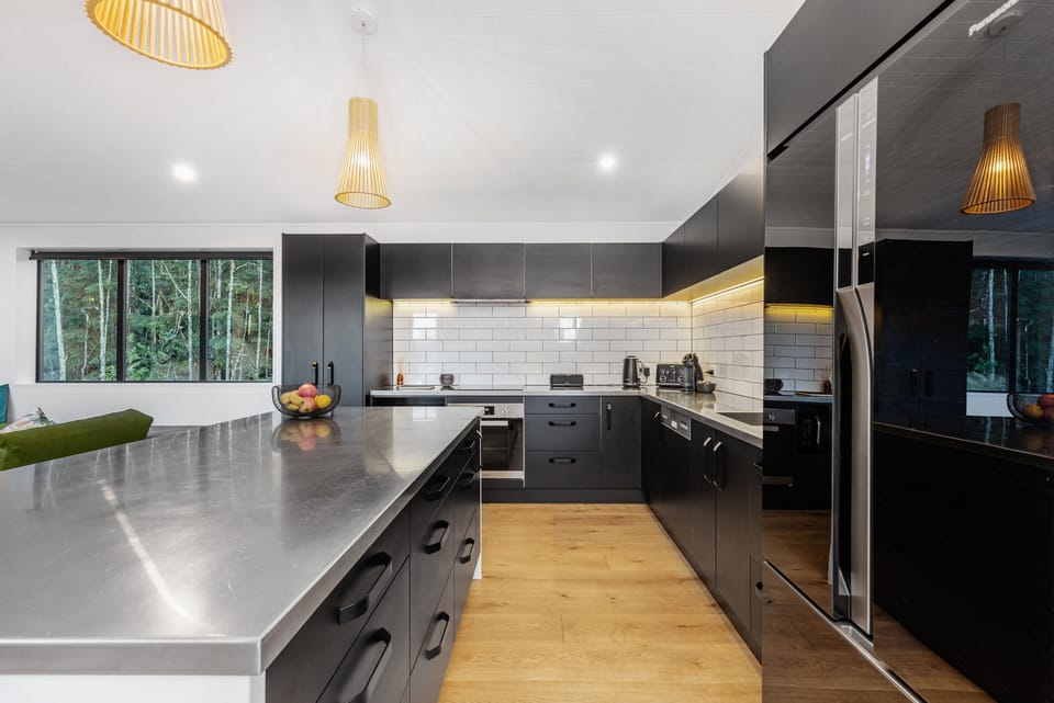 The kitchen includes grills, a rice cooker and champagne glasses.