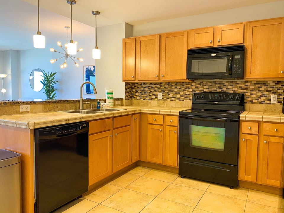 Full kitchen complete with stove + microwave + dishwasher + toaster + coffee maker!