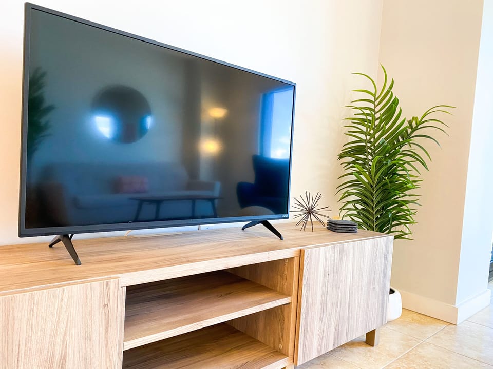 Large flat screen TV in the living room! Coasters are also provided in the unit!