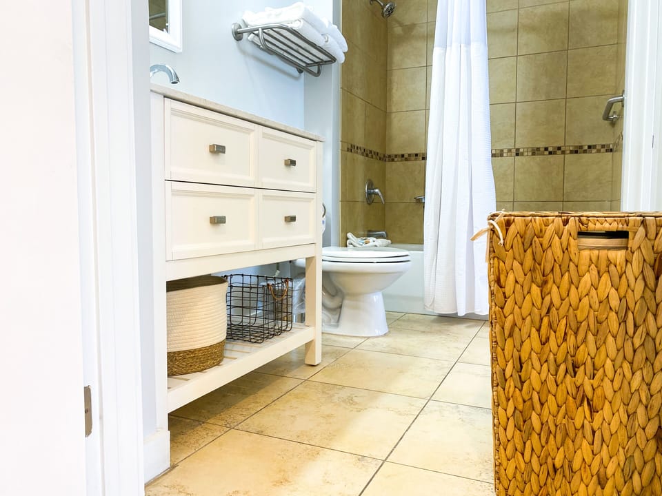 Laundry hamper + extra storage contained stocked in the bathroom!