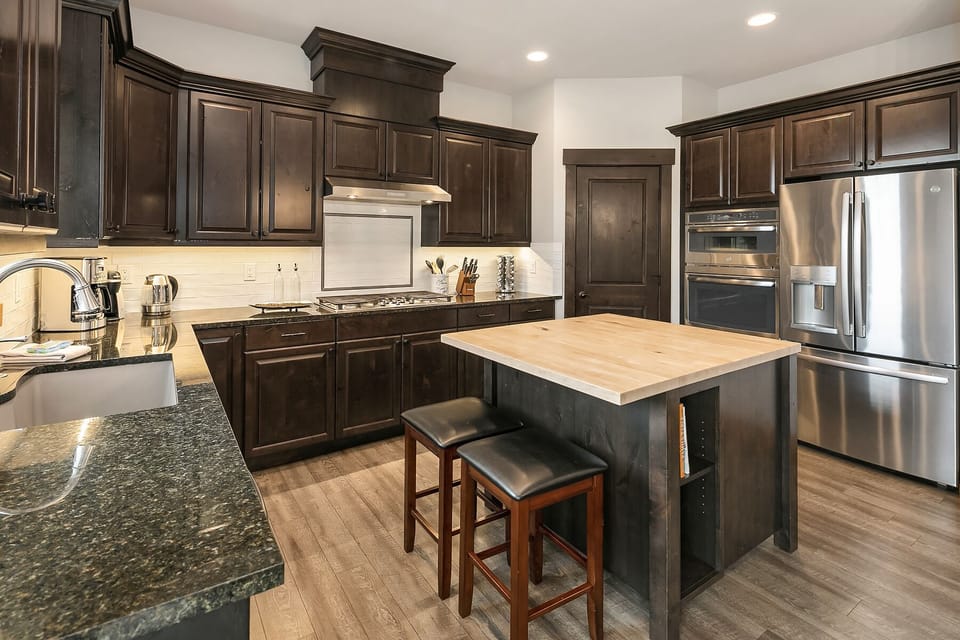 Zen Den: - Large kitchen with a center island for extra prep space.