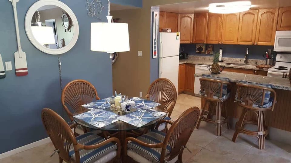 There is seating for up to six people between the dining table and the counter. 