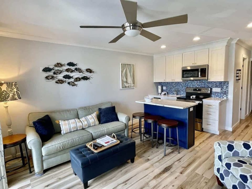 A bright, airy living space featuring a coastal-inspired palette.