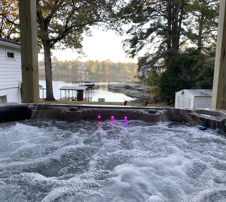 Hot tub sitting with a Lake Hamilton View