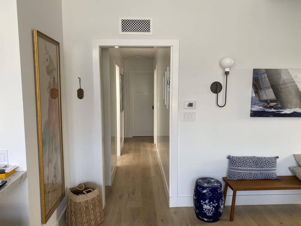 Hallway to bathrooms and bedroom