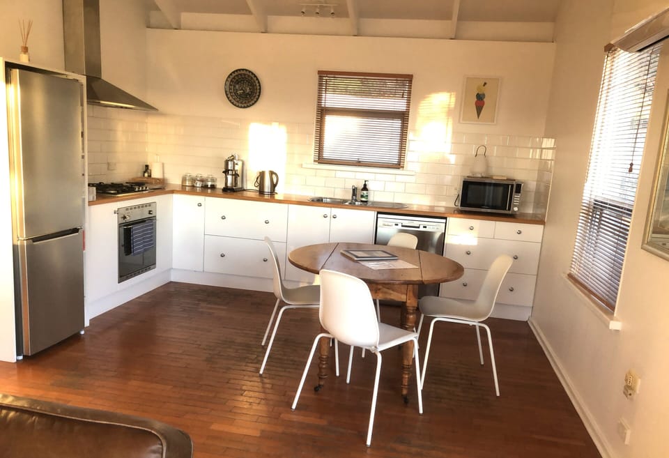 Kitchen-dining bathed in the afternoon glow of sunset