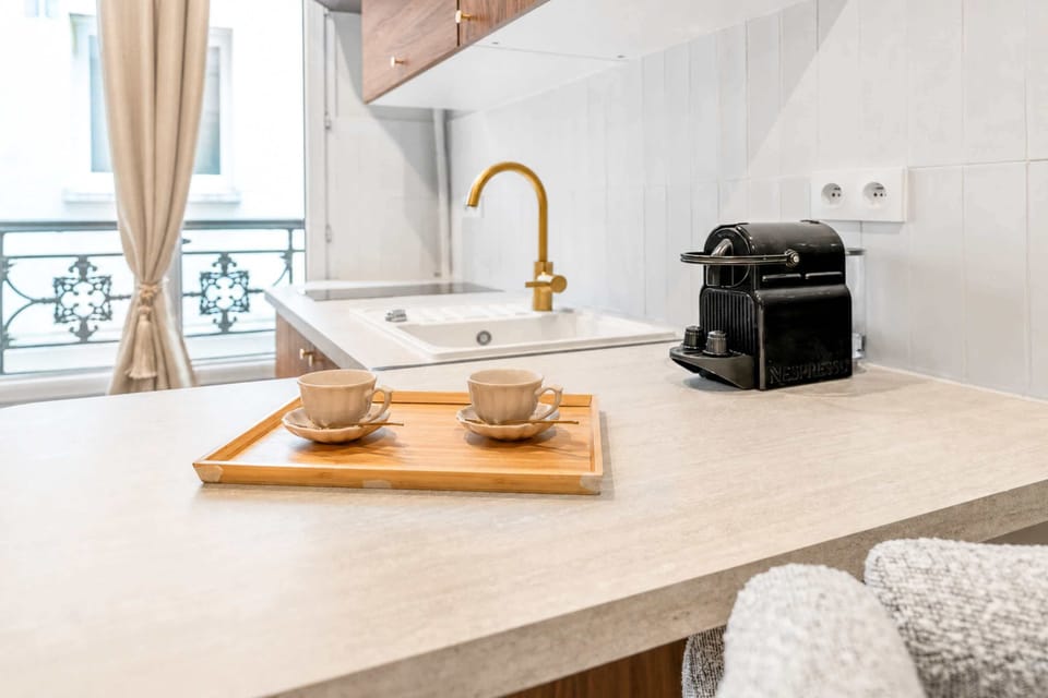 Functional kitchen featuring all essentials, plus a convenient washer