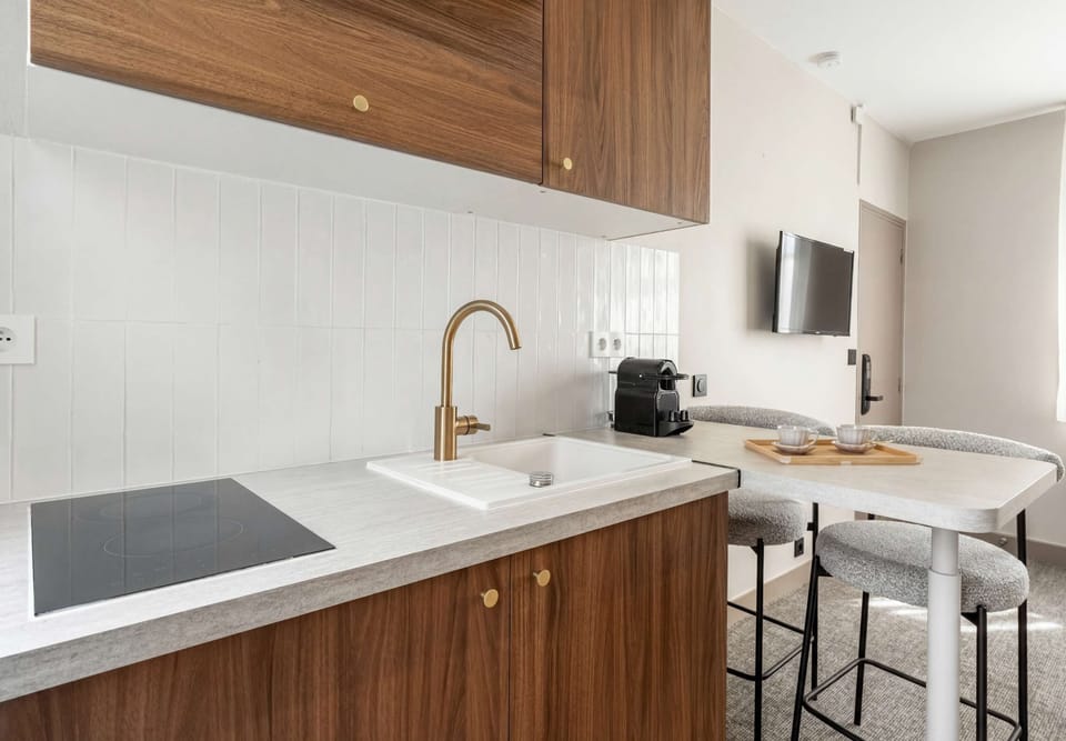 Practical kitchen, charming dining area, and inviting coffee corner