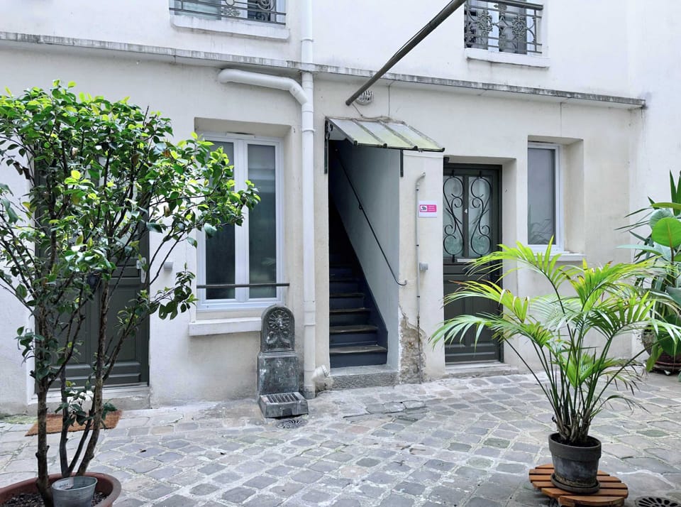 The nice and calm courtyard of the Parisian building.