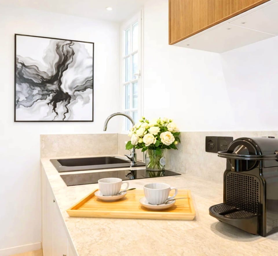 Cozy kitchenette stocked with utensils and appliances for a stress-free stay.