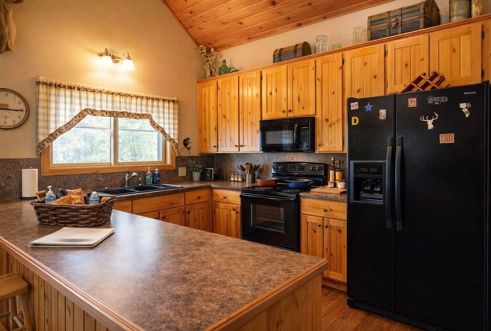 Fully stocked kitchen with modern appliances, coffee maker & everything you need for family meals.