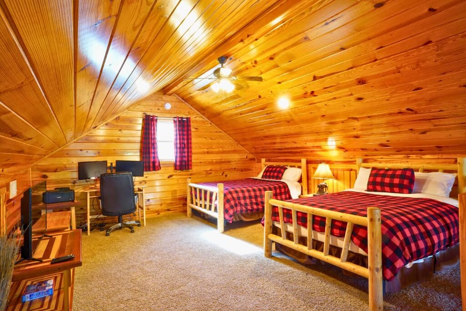 Loft sleeping area with 2 full beds + full pull-out sofa — perfect for kids or extra guests.