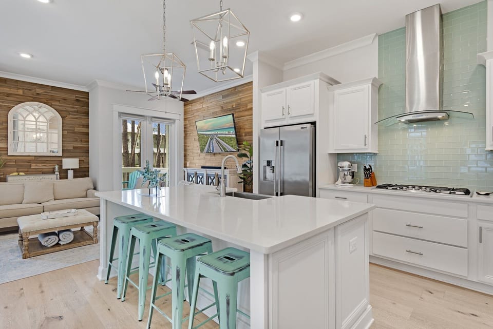 Kitchen with a large center island with stools.