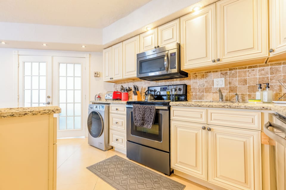 In-unit washer/dryer in the kitchen—convenient laundry for extended beach stays.
