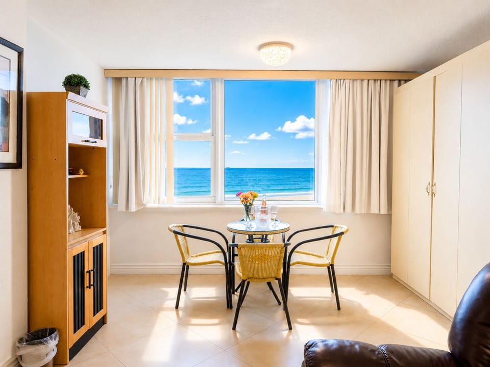 Bright dining nook with ocean views—enjoy breakfast while watching the waves.