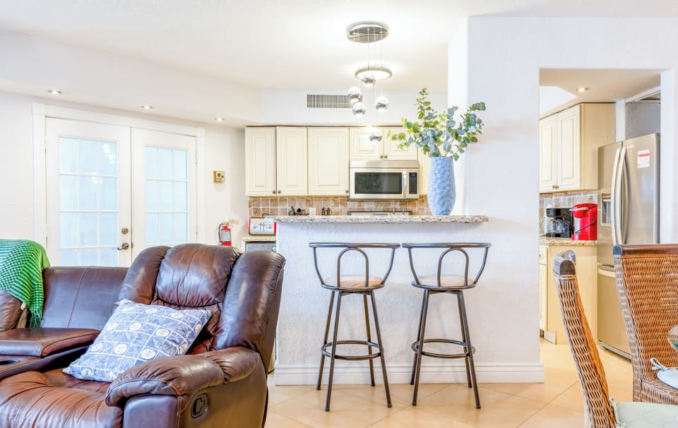 Kitchen island with bar seating—perfect for morning coffee or casual meals.