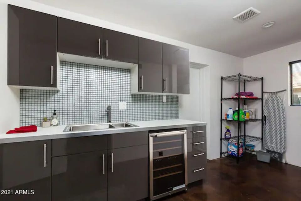 2nd master bedroom's mini kitchen w/wine fridge and sink.