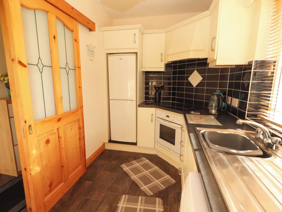 Fridge, microwave, cookware/dishes/utensils