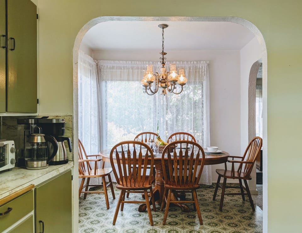 The Dining Room Table has a leaf for larger parties and extends to comfortably seat 6.