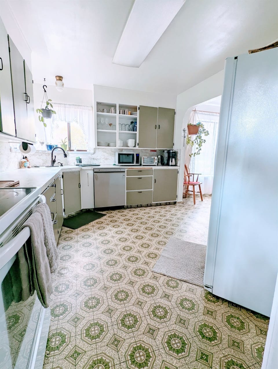 The kitchen has been updated with a dishwasher & convenient appliances.