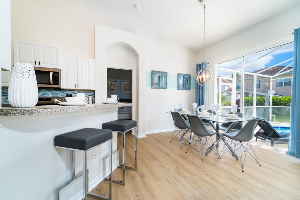 breakfast bar and dining area in an open concept setting