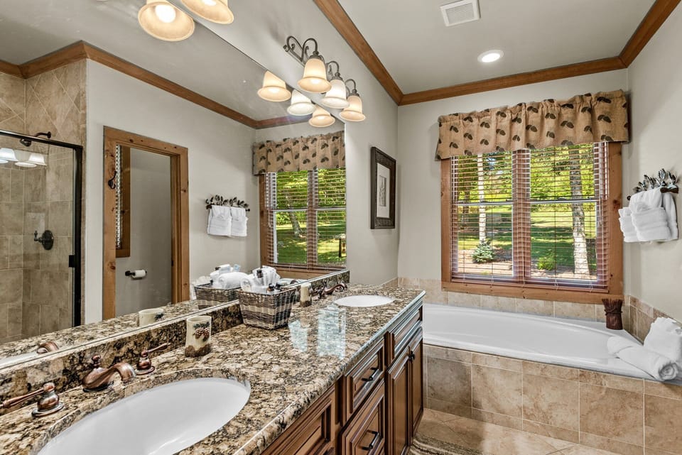 A spa-like retreat with double sinks, a soaking tub, and garden views. Plenty of room to unwind after a day on the slopes.