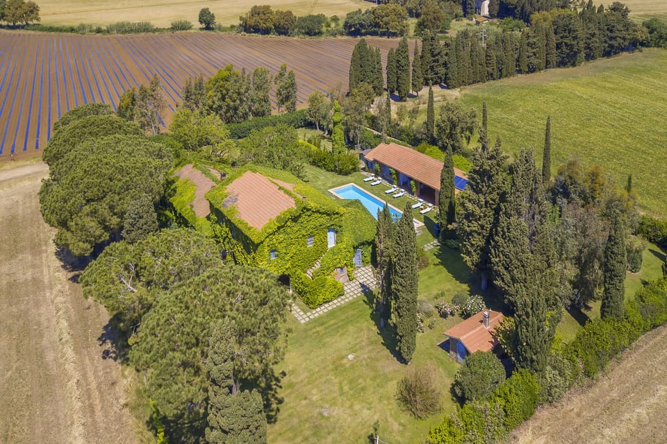 The view of whole property surrounded by well kept green spaces