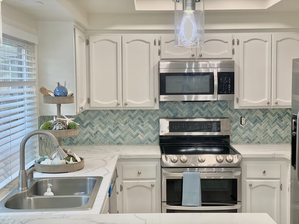 Fully stocked kitchen for entertaining. Keurig, in sink water filter. Ice-maker