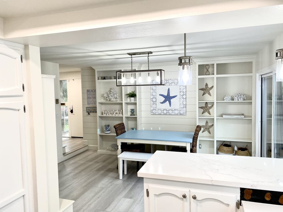 Dining room, has 2 bench seats and 2 chairs, room for 6-8