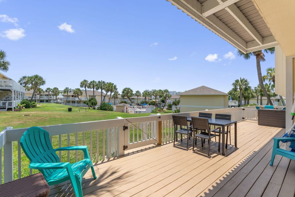 Unwind on your private deck overlooking tropical landscaping and palm trees, perfect for morning coffee or evening dining.