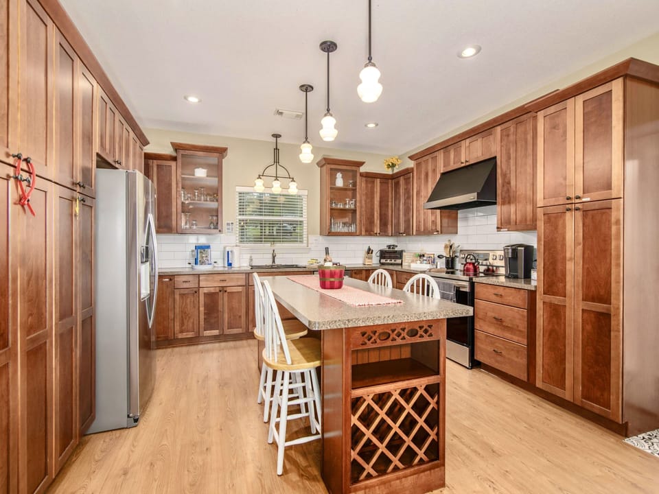 Chef’s kitchen with brand-new stainless steel refrigerator, dishwasher and oven 