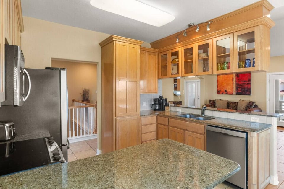 Spacious Kitchen with Granite Counters & Bar Seating