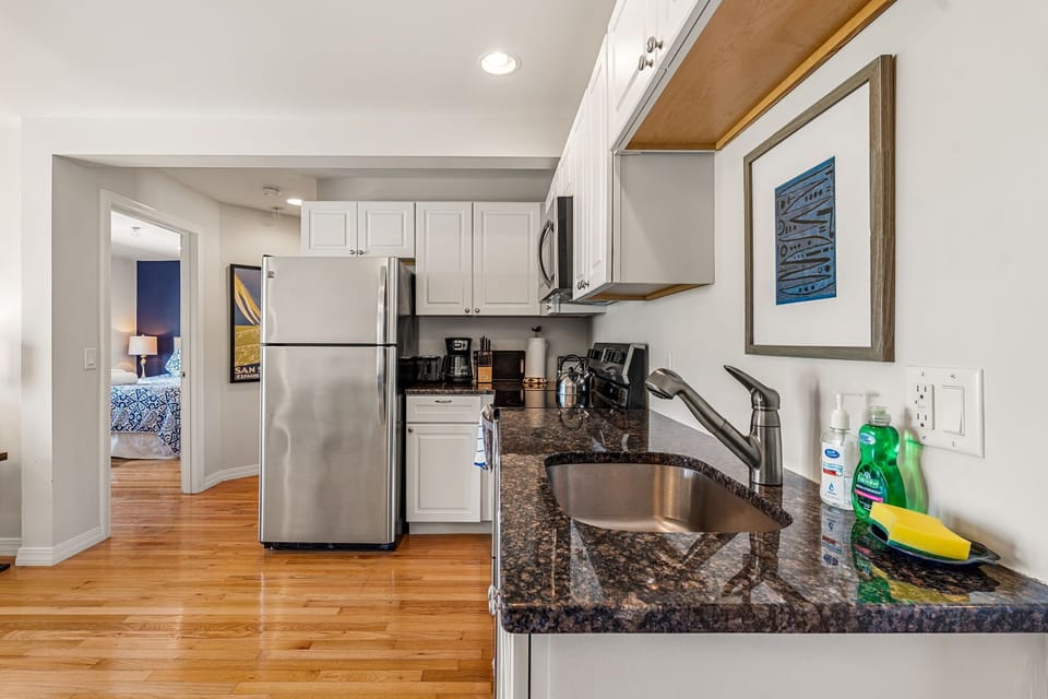 Full kitchen with stainless steel appliances 
