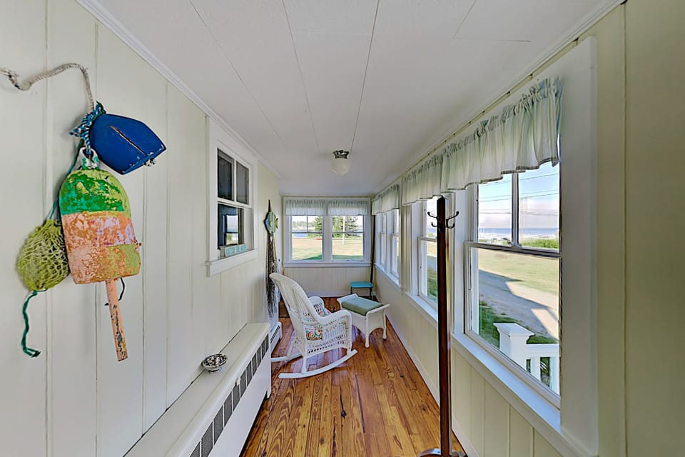 The sun porch is a great spot on rainy days.  Watch the storm roll in over the harbor.